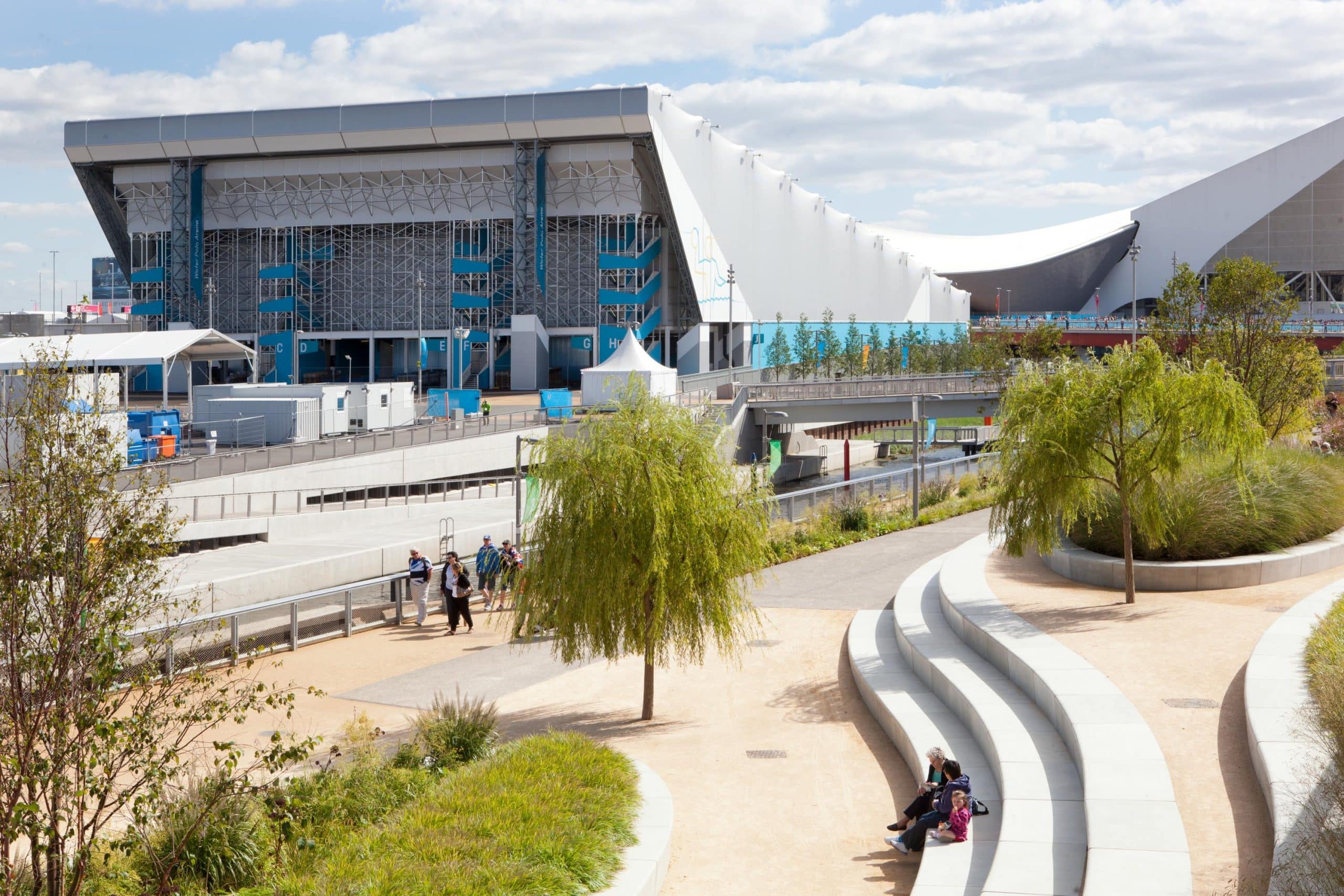 External view of the waterpolo arena from London 2012 Olympic and Paralympic Games with fans occupying the public landscaped space